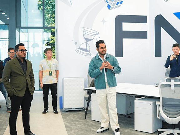 FundedNext Employee Speaking at Meeting in Conference Room