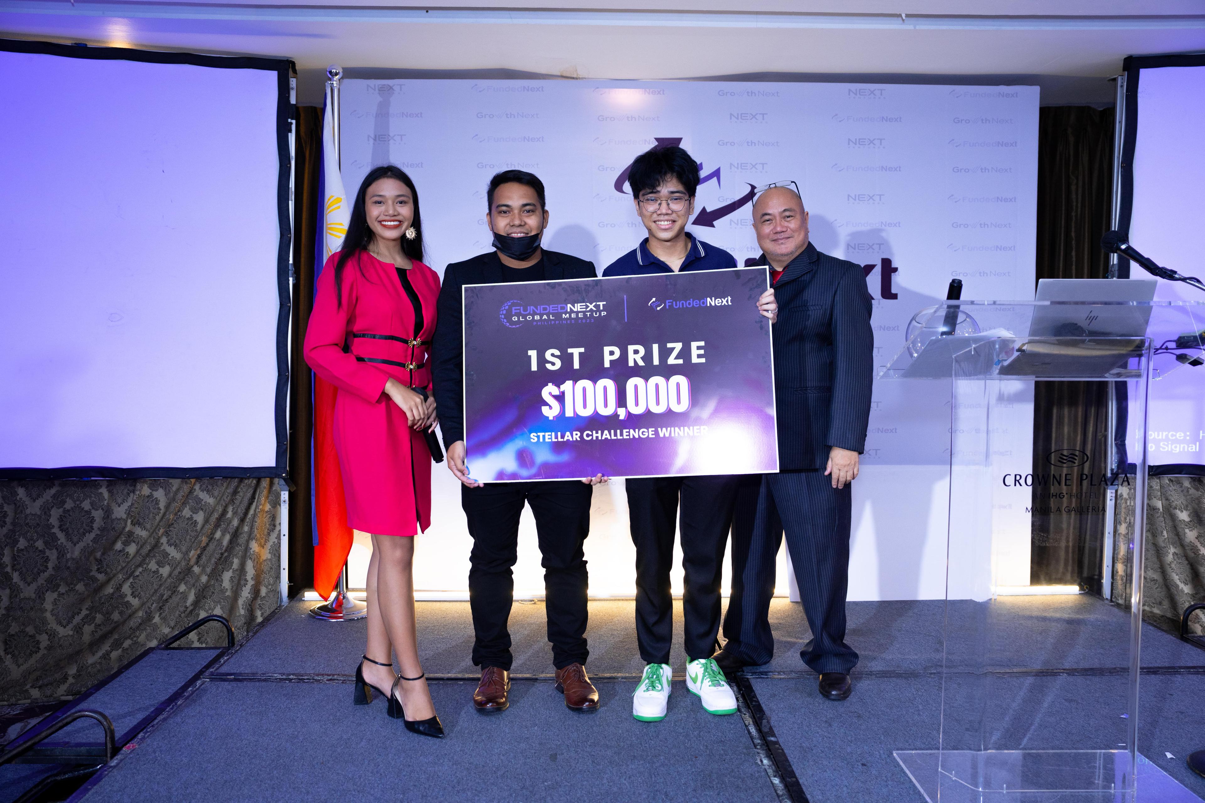 1st Place Winning Trader of FundedNext Challenge being Presented $100,000 Check Prize - FundedNext